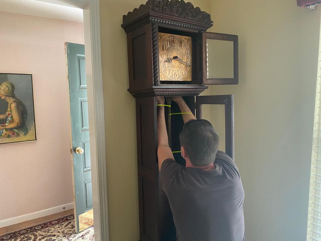 A man sets weights for a watch