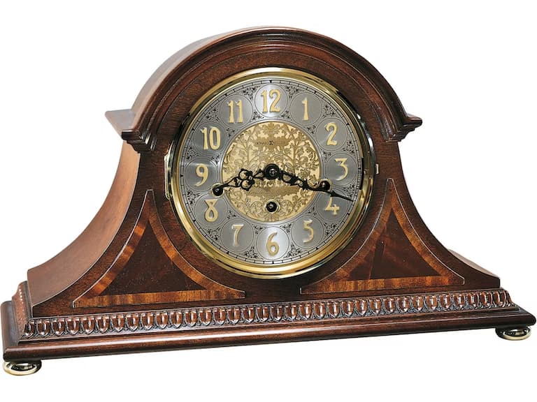 Several antique clocks near a bright wall